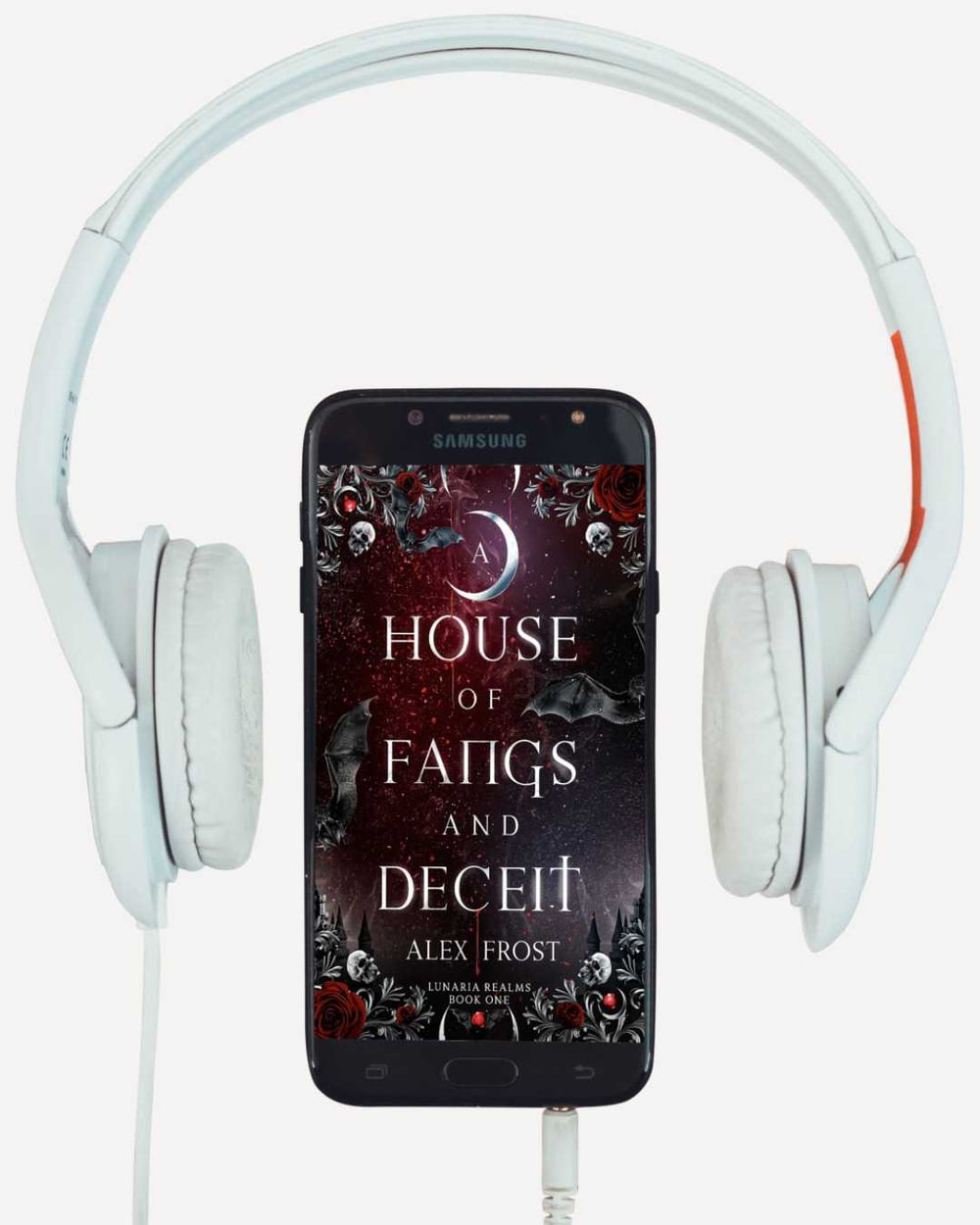 Phone displaying 'A House of Fangs and Deceit' by Alex Frost with white headphones on a white background
