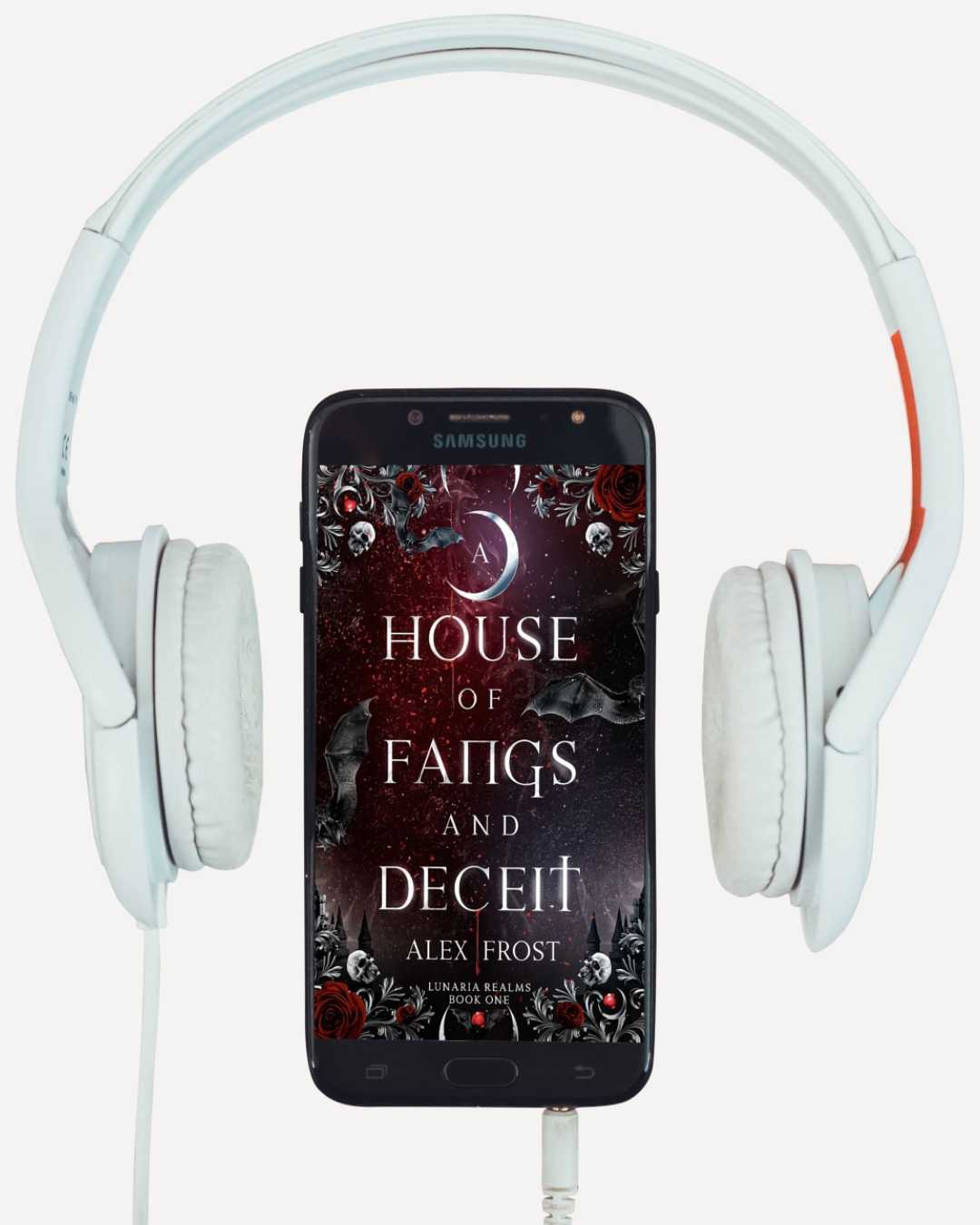 Phone displaying 'A House of Fangs and Deceit' by Alex Frost with white headphones on a white background