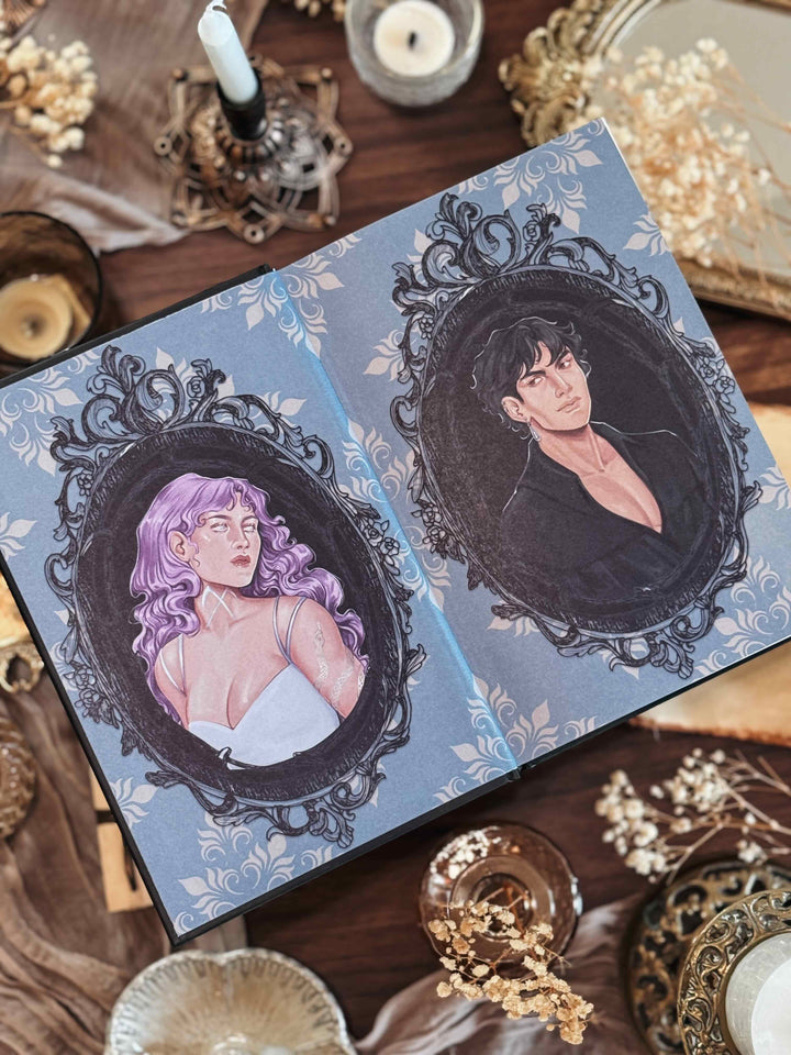 Fantasy romance book with illustrations of two people in ornate frames on a decorative surface.